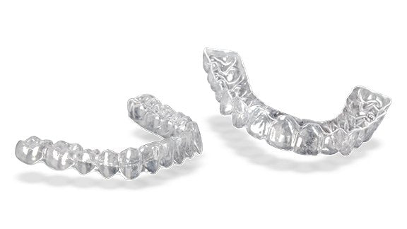 Two Custom Clear Retainers showcased on a white background, emphasizing their clear, durable design, best retainers for after-braces dental care - Snap Custom Nightguards