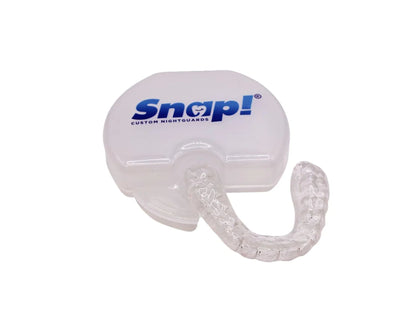 Snap Custom Daytime Teeth Grinding Guard with Case, a clear and discreet solution for those who grind their teeth during daylight hours. Presented with its dedicated storage case bearing the Snap Custom Nightguards logo, this guard offers the same protection as a traditional nightguard but is designed to be less noticeable for daytime use. The image highlights the guard's transparent material and the compact, portable case, perfect for on-the-go dental care.